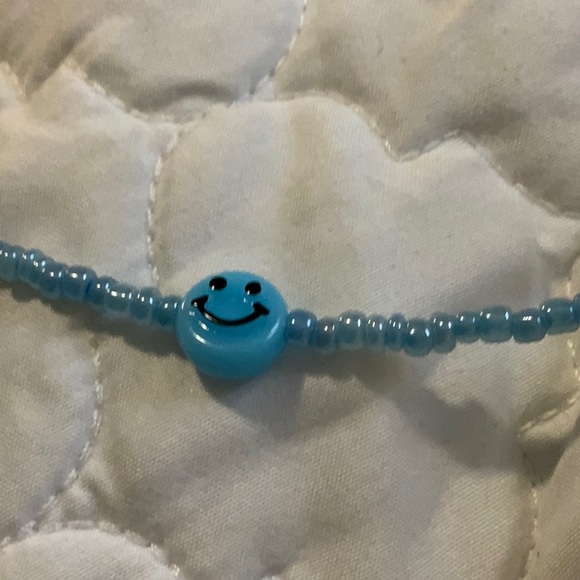 i am selling a blue smiley face necklace. - Picture 3 of 3